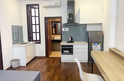 Wooden floor studio apartment for rent on Ton That Thuyet street