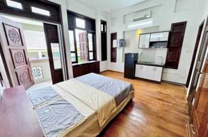 Wooden floor serviced apartment for rent with balcony in District 1