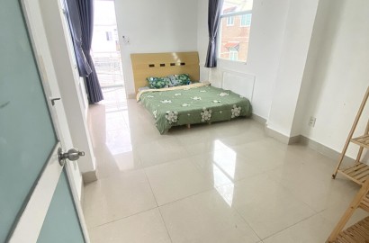 Room for rent with balcony on Phan Dang Luu street