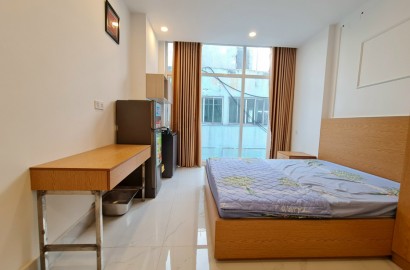 Studio apartmemt for rent with window on Huynh Tan Phat street