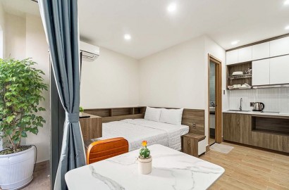 Bright serviced apartmemt for rent with balcony on Nguyen Cuu Van Street