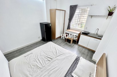 Studio apartmemt for rent with window on Tran Quang Dieu street