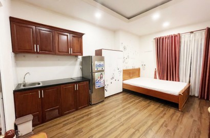 Clean studio apartment with large window on Hoa Hung street