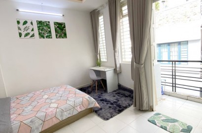 Serviced apartment with balcony right at Phu Nhuan intersection