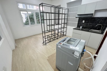 Serviced apartment with its own washing machine on Nguyen Huu Canh street