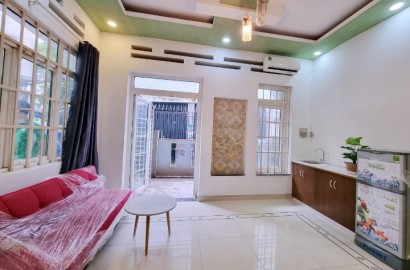 Ground floor serviced apartment with private yard on Hoa Hao street