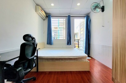 Wooden floor studio apartment for rent with balcony on Co Giang Street